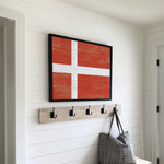a bench with a purse and coat rack on it