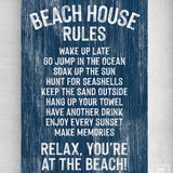 Beach House Rules Sign, Painted Wood, Nautical—this blue sign features white text with fun "Beach House Rules" ending in "Relax, you're at the beach!" for a charming coastal wall art accent.