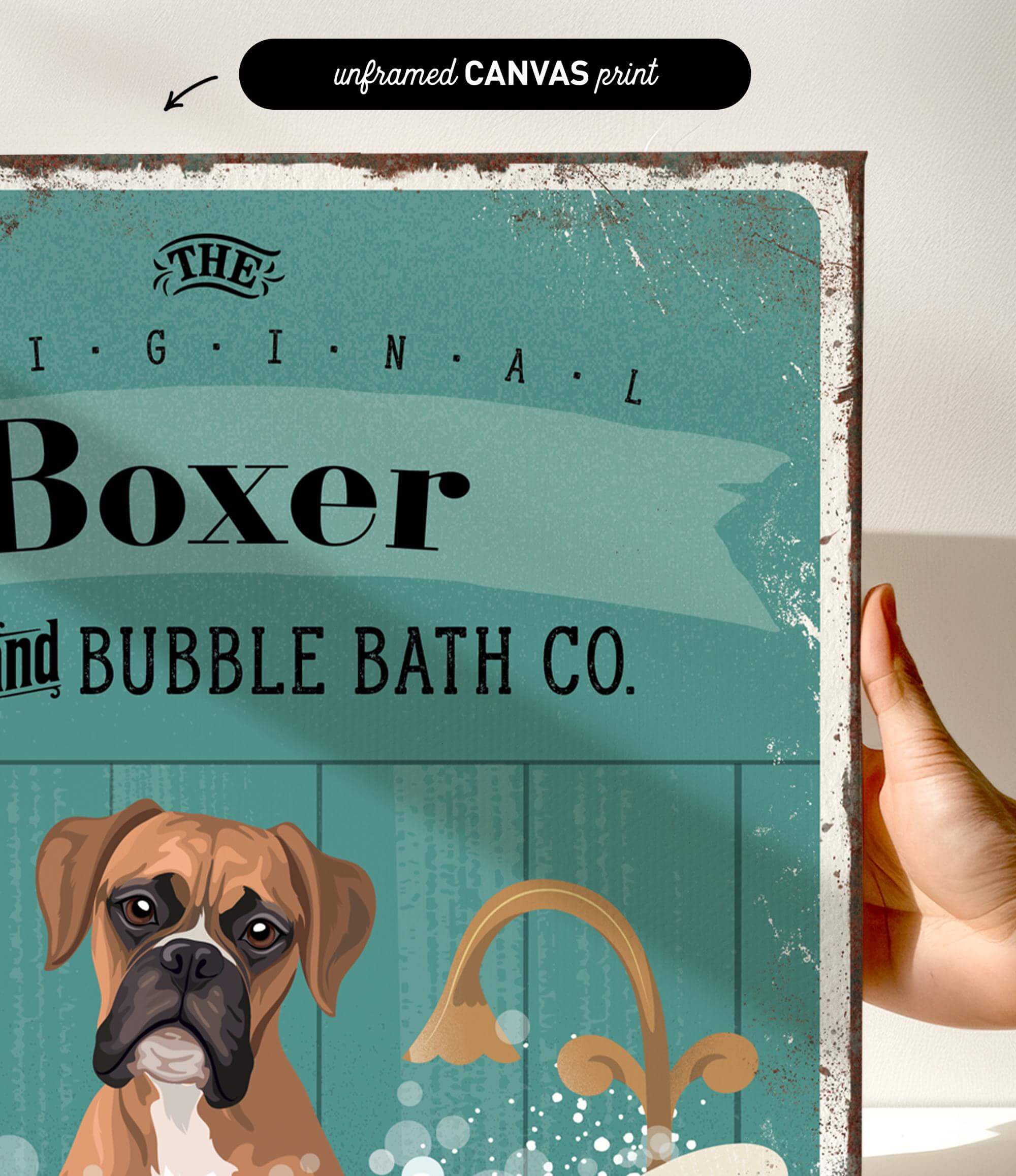 a hand holding a framed print with a vintage-style illustration of a boxer dog.