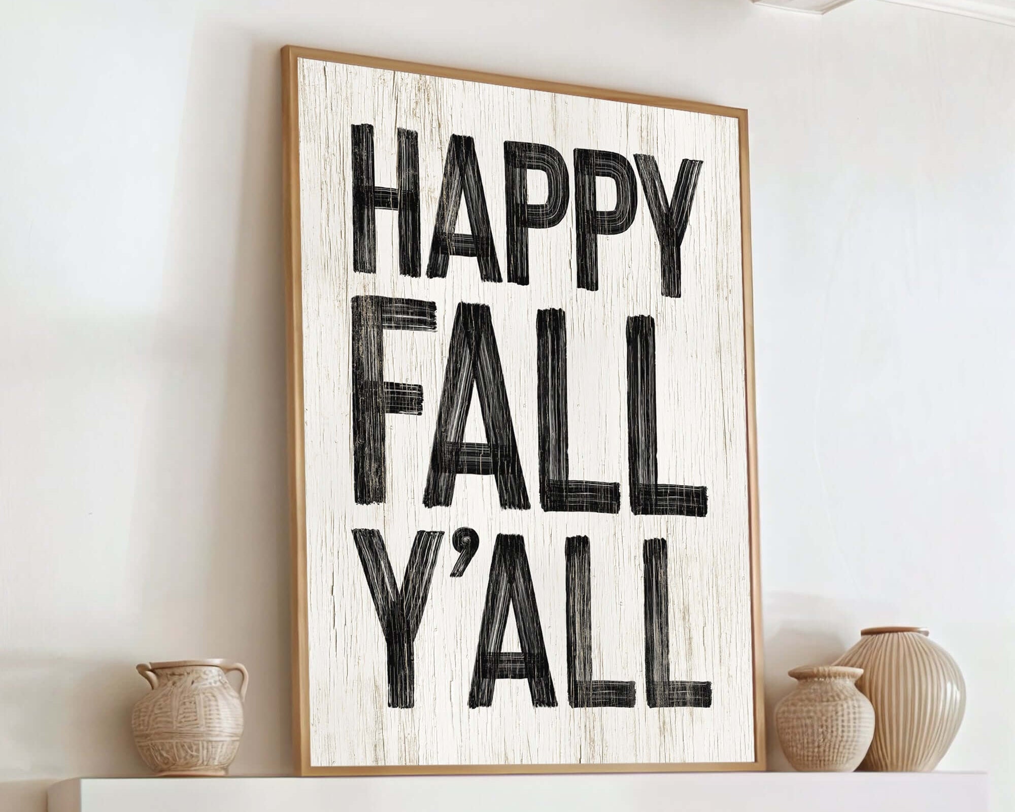 a happy fall y'all sign on a fireplace mantel