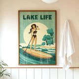 a framed poster of a woman paddleboarding on a lake, with the text "LAKELIFE" prominently displayed.