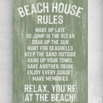 The Beach House Rules Sign is a green seagrass-painted wooden sign with white text—“Relax, you’re at the beach!”—making it perfect coastal wall art for your seaside retreat.