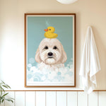 A framed illustration of a white dog with a yellow rubber duck on its head, set against a blue background with white bubbles.