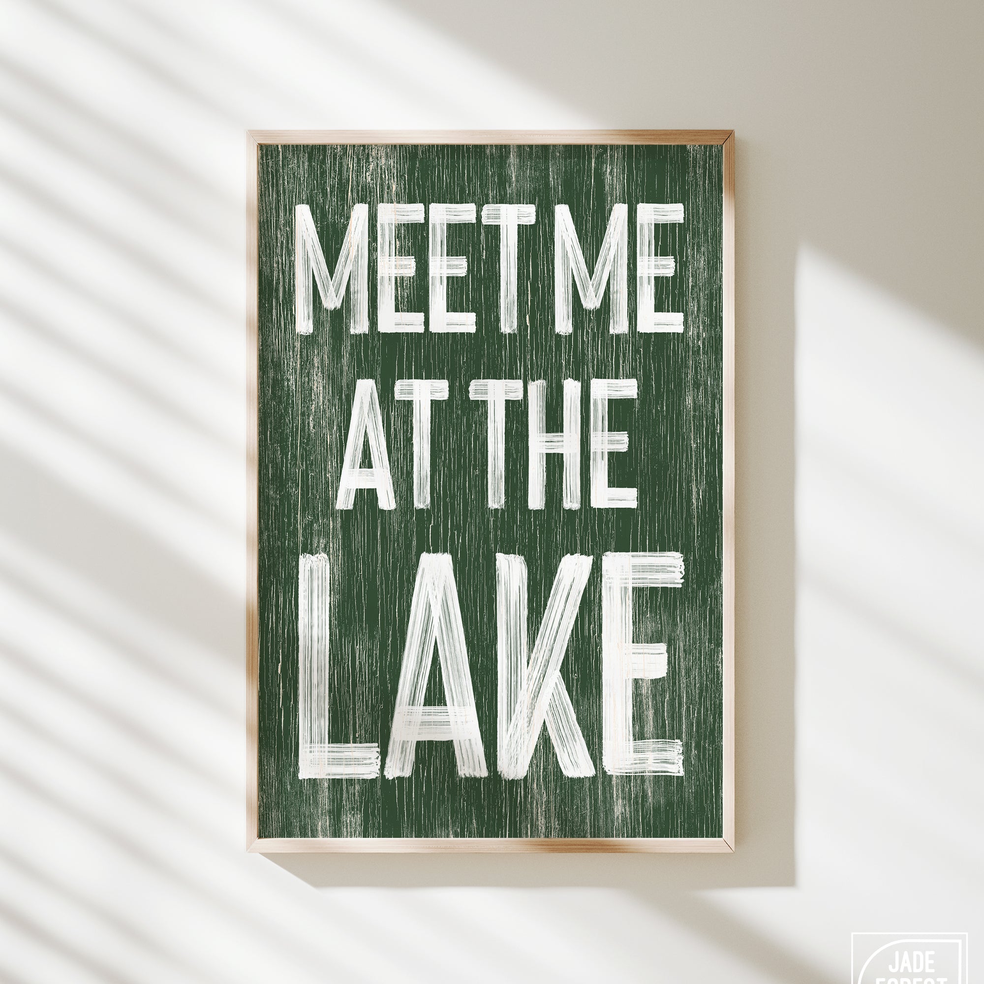 a green sign that says meet me at the lake