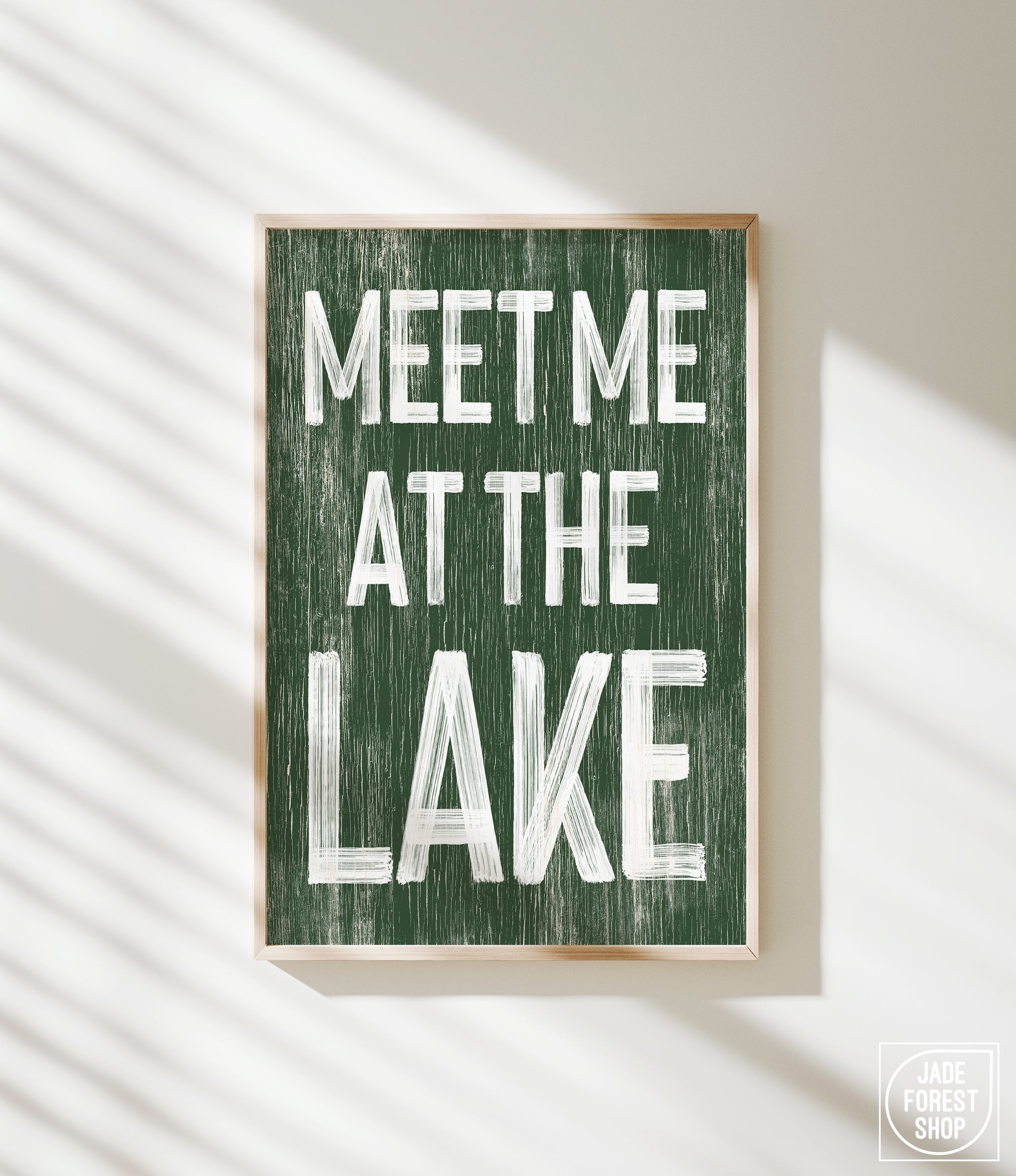 a green sign that says meet me at the lake