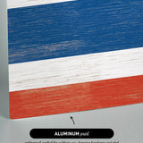 a close up of a piece of wood with the colors of the flag of the