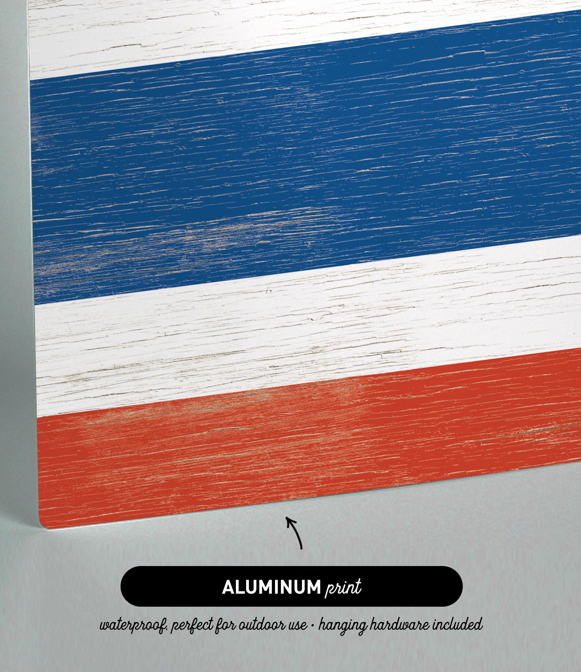 a close up of a piece of wood with the colors of the flag of the