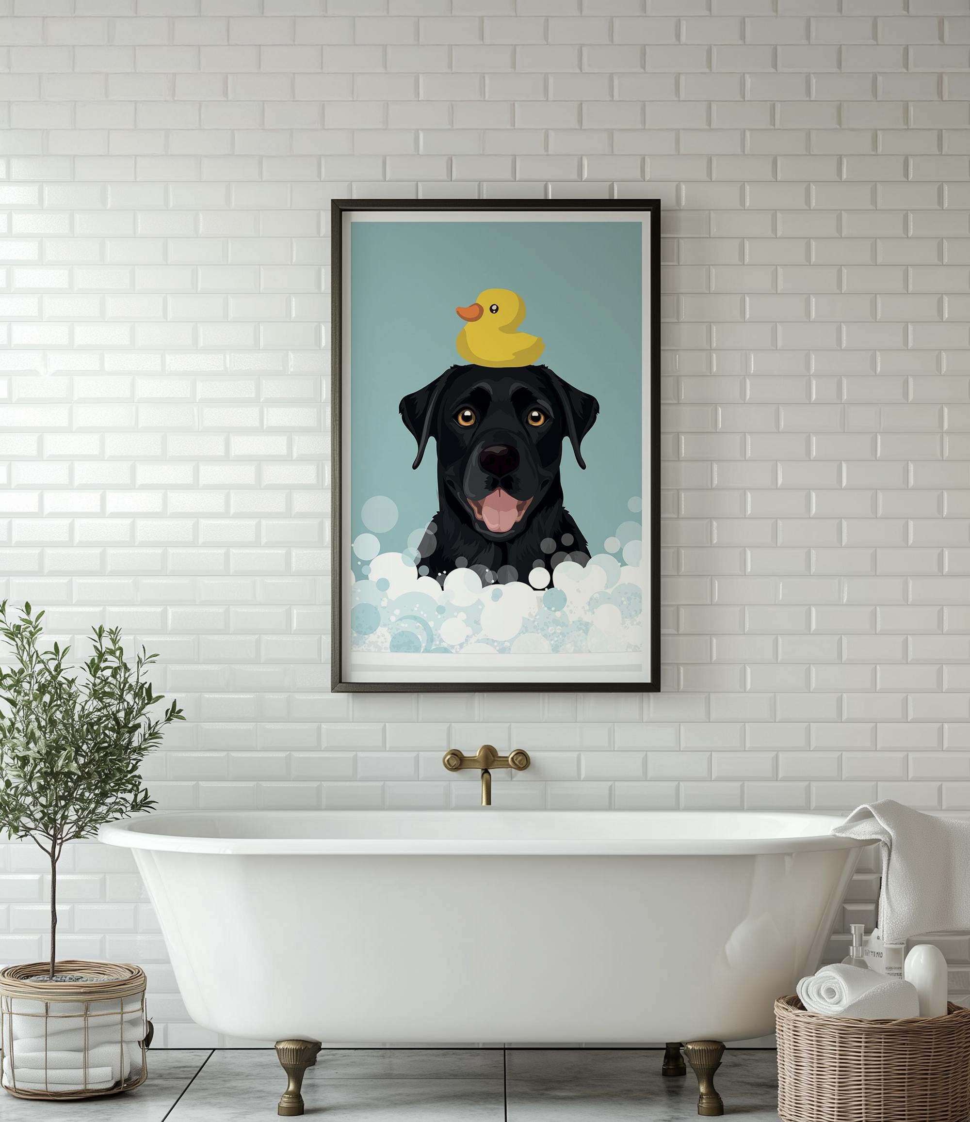 A framed illustration of a black dog with a yellow rubber duck on its head, sitting in a bathtub filled with bubbles, is displayed on a white tiled wall above a white freestanding bathtub.