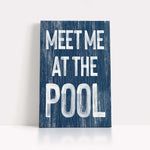 a wooden sign that says meet me at the pool