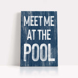 a wooden sign that says meet me at the pool