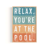 a wooden sign that says relax you're at the pool