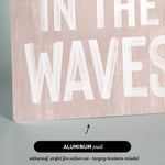 a sign that says in the waves on it