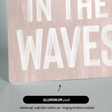 a sign that says in the waves on it