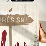 a hand holding a sign that says tres ski