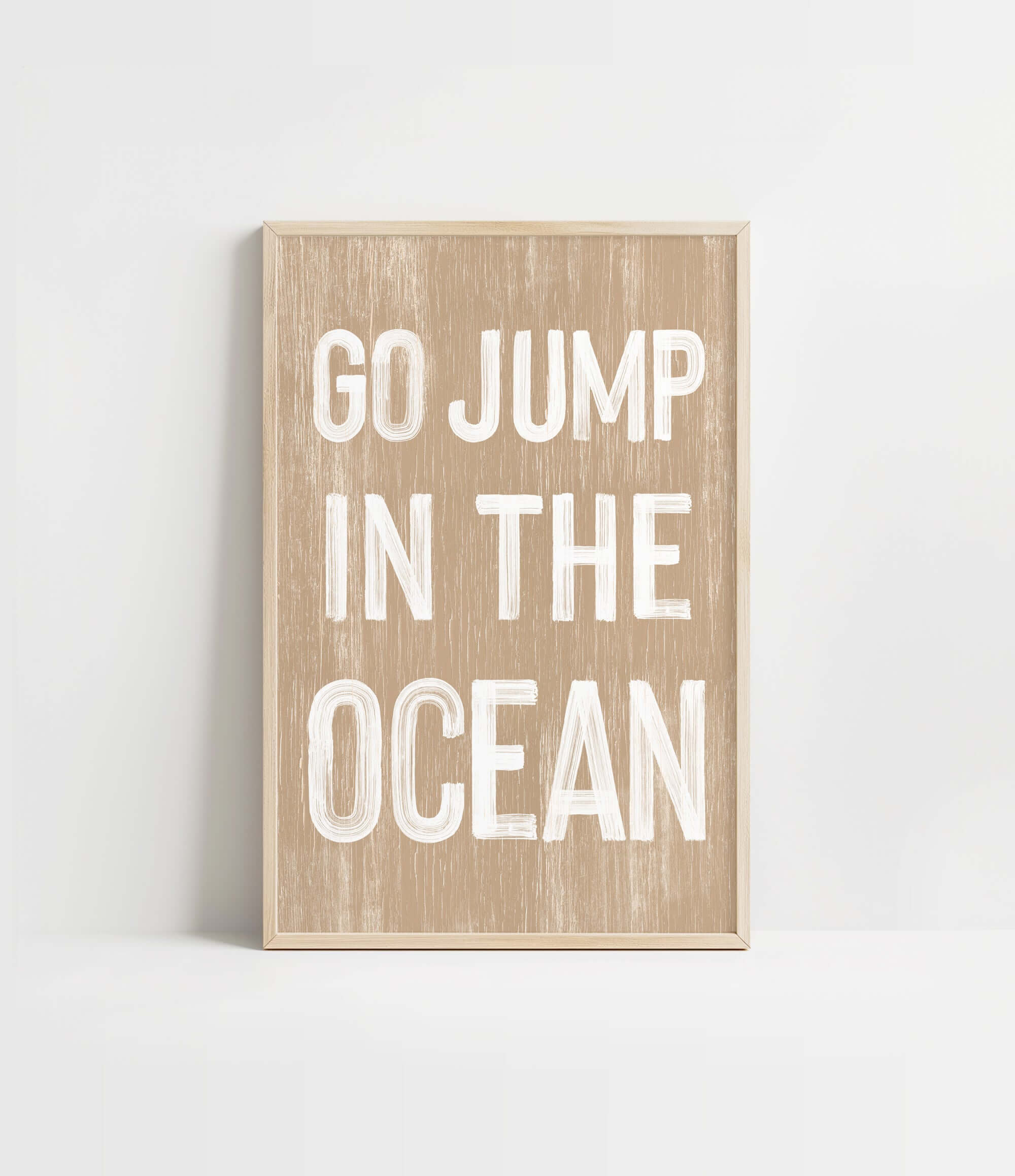 a wooden sign that says go jump in the ocean