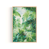 The image is a framed painting depicting a lush, tropical scene with vibrant green palm leaves and other tropical foliage.