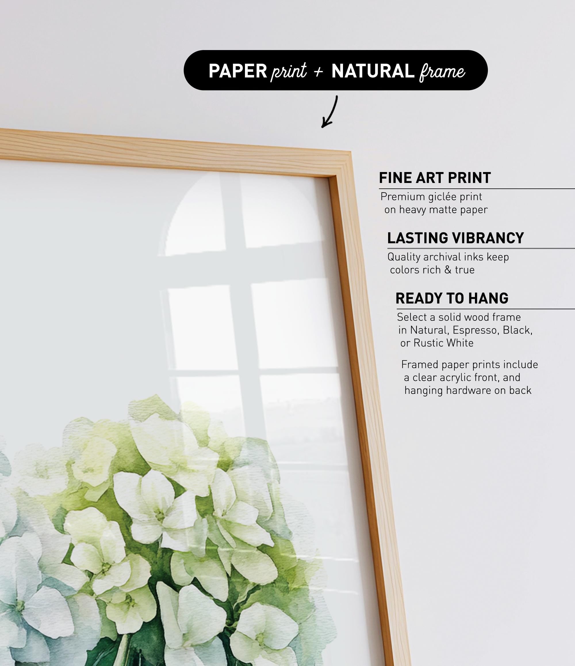 a close-up of a beautiful arrangement of white flowers, with a wooden frame surrounding them.