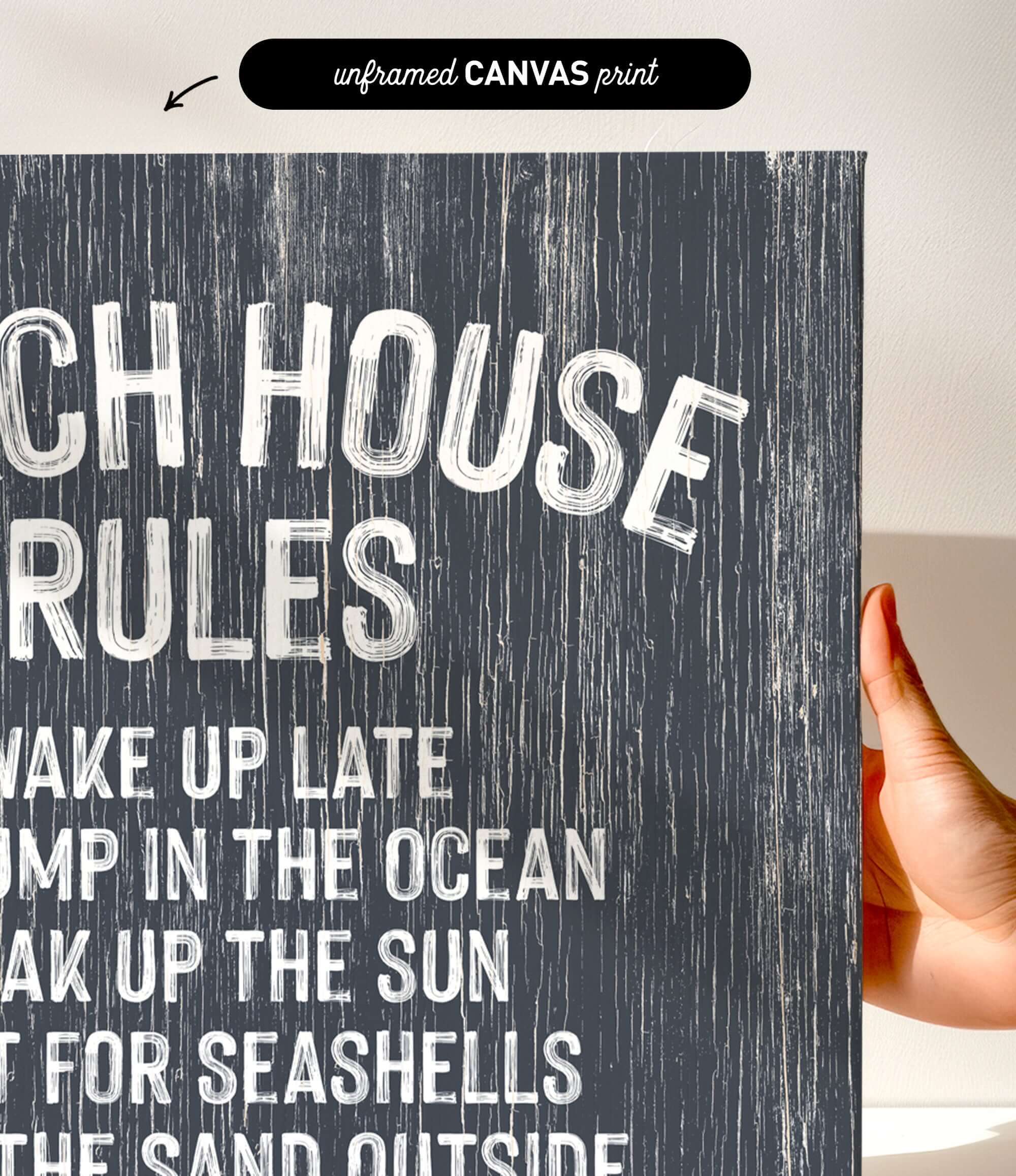 a hand holding a canvas print with the text "CHEACH HOUSE RULES" written on it.