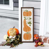 a picture of pumpkins and gourds on a porch