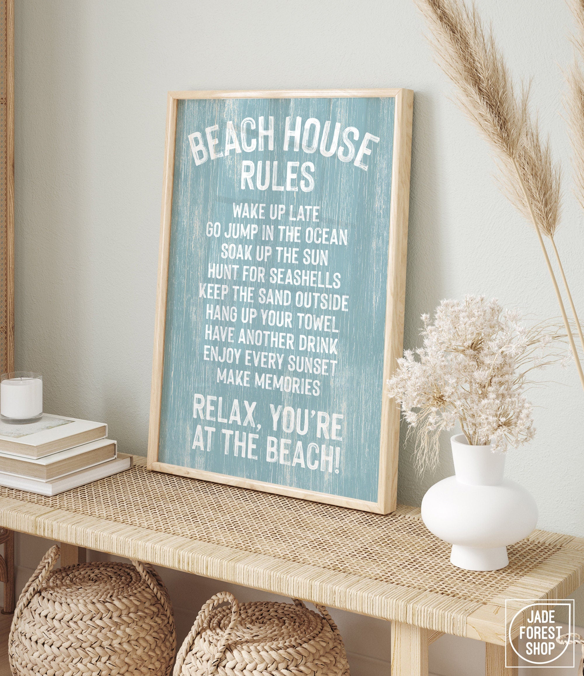 The Beach House Rules Sign in painted wood, Tide, features relaxing rules and makes charming beach house wall decor when displayed with coastal accents.