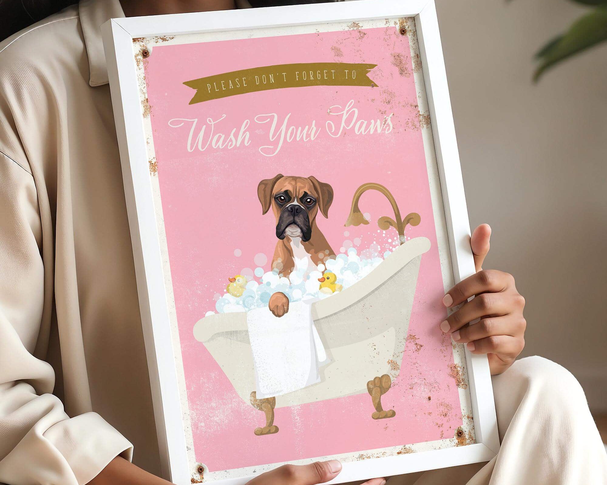 A woman is holding a framed poster with a cartoon image of a dog sitting in a bathtub, surrounded by bubbles.