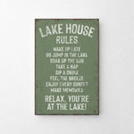 a green sign that says lake house rules