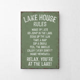 a green sign that says lake house rules