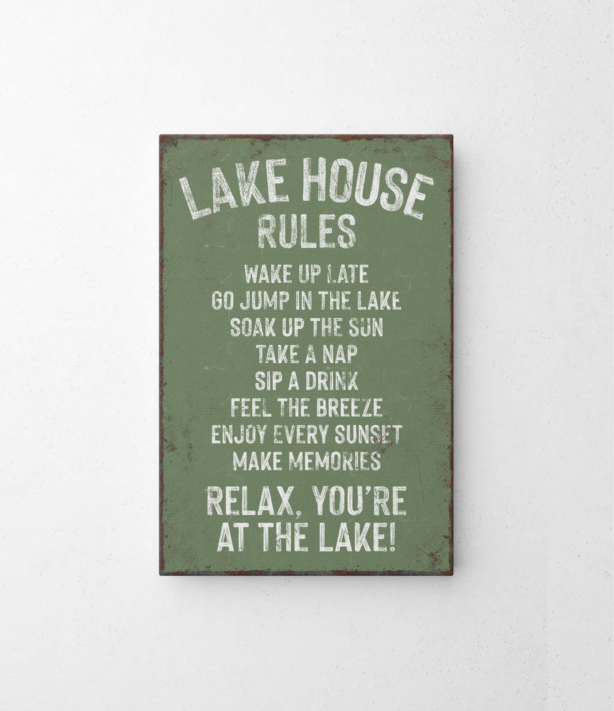 a green sign that says lake house rules