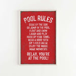 a red poster hanging on a white wall