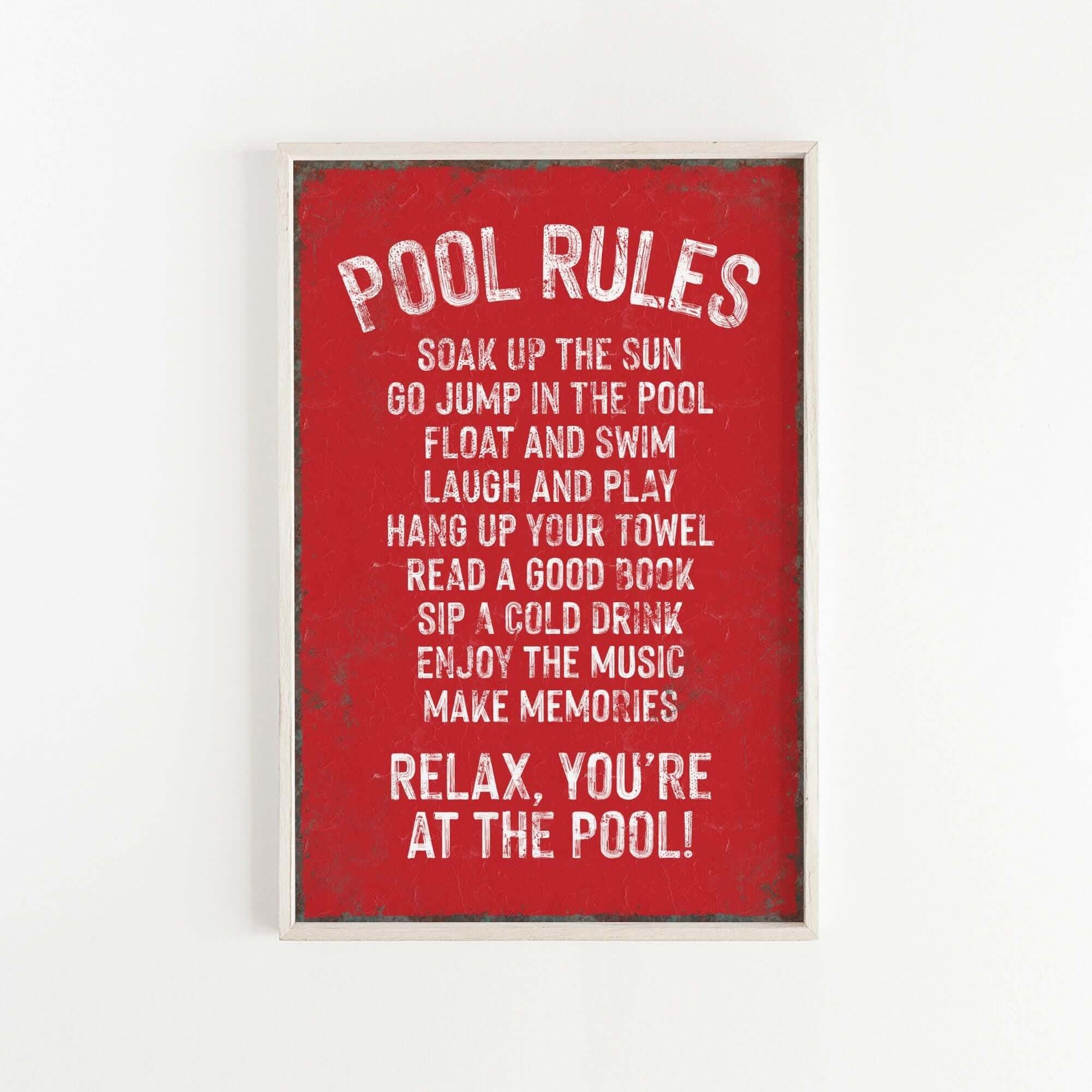 a red poster hanging on a white wall
