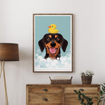 A framed illustration of a dog with a yellow rubber duck on its head, surrounded by bubbles, is displayed on a wall above a wooden dresser.