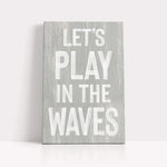 a wooden sign that says let&#39;s play in the waves