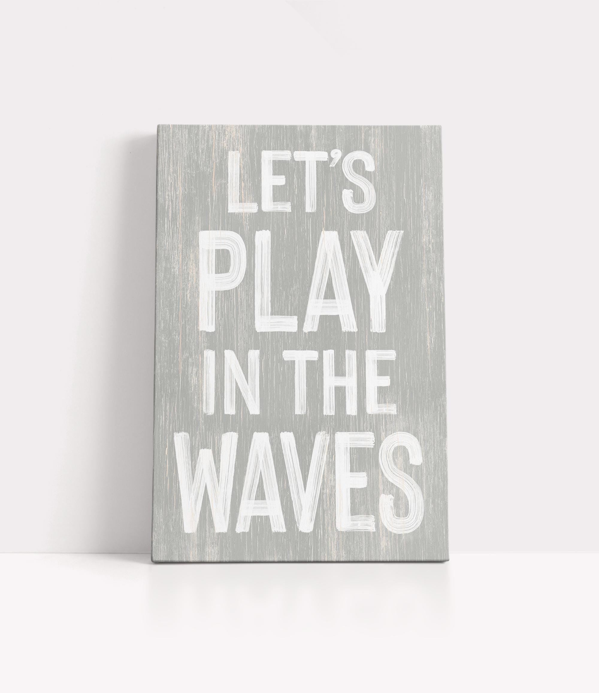 a wooden sign that says let&#39;s play in the waves