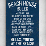 a blue sign that says beach house rules