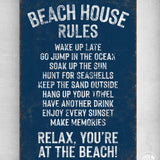 a blue sign that says beach house rules