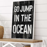 a sign that says go jump in the ocean