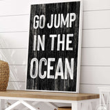 a sign that says go jump in the ocean