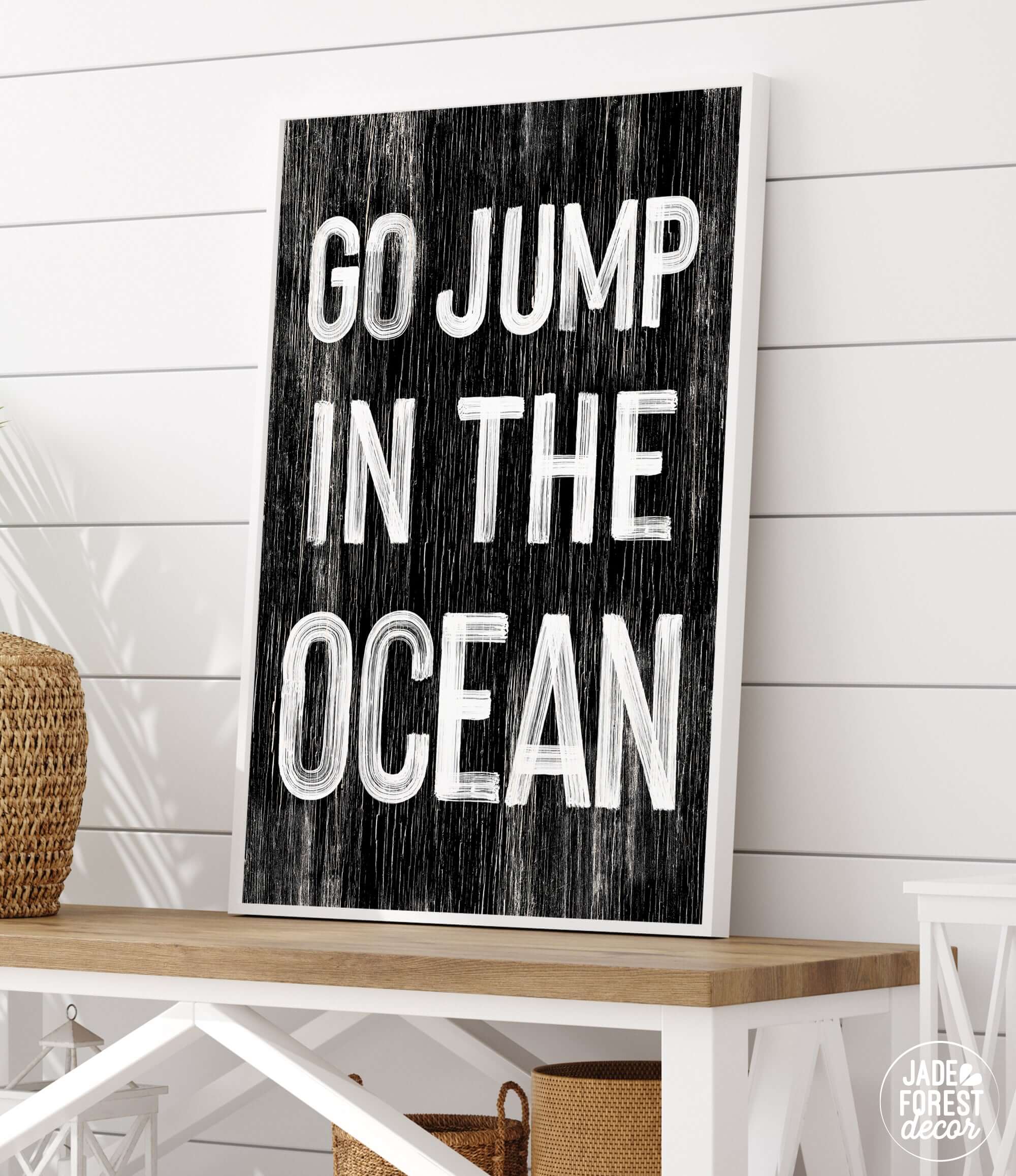 a sign that says go jump in the ocean