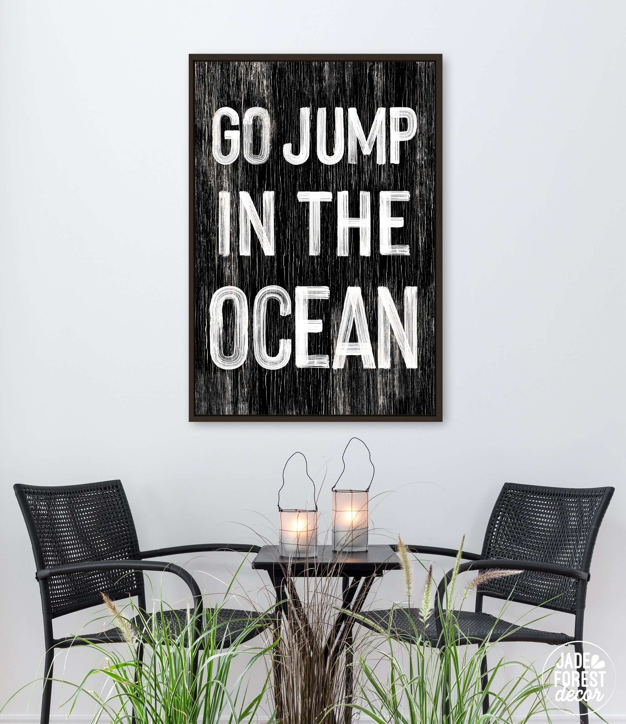 a table with two chairs and a sign that says go jump in the ocean