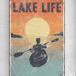 a poster of a man in a kayak on a lake