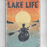 a poster of a man in a kayak on a lake