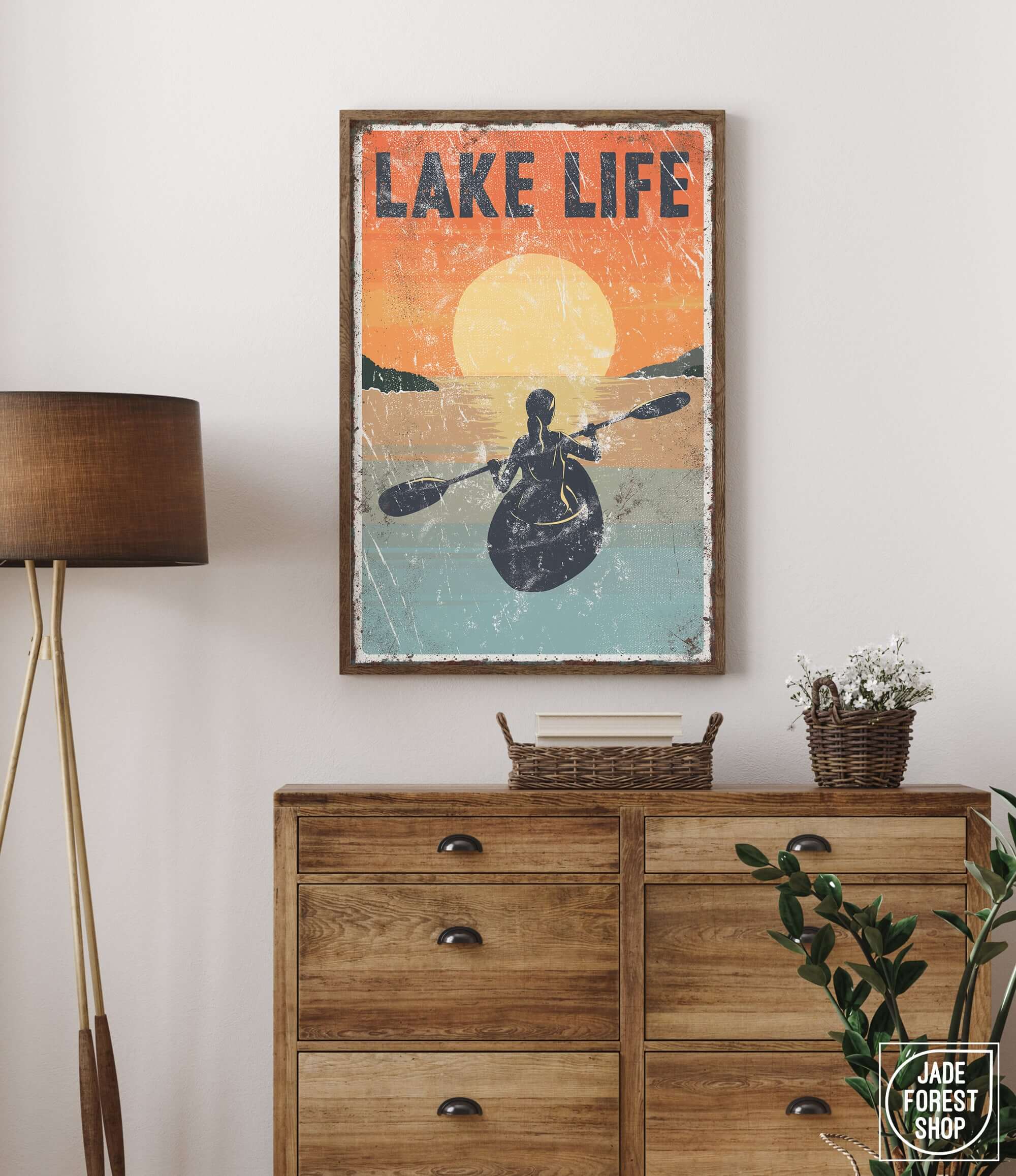 a vintage poster of a man in a kayak hangs on a wall above a