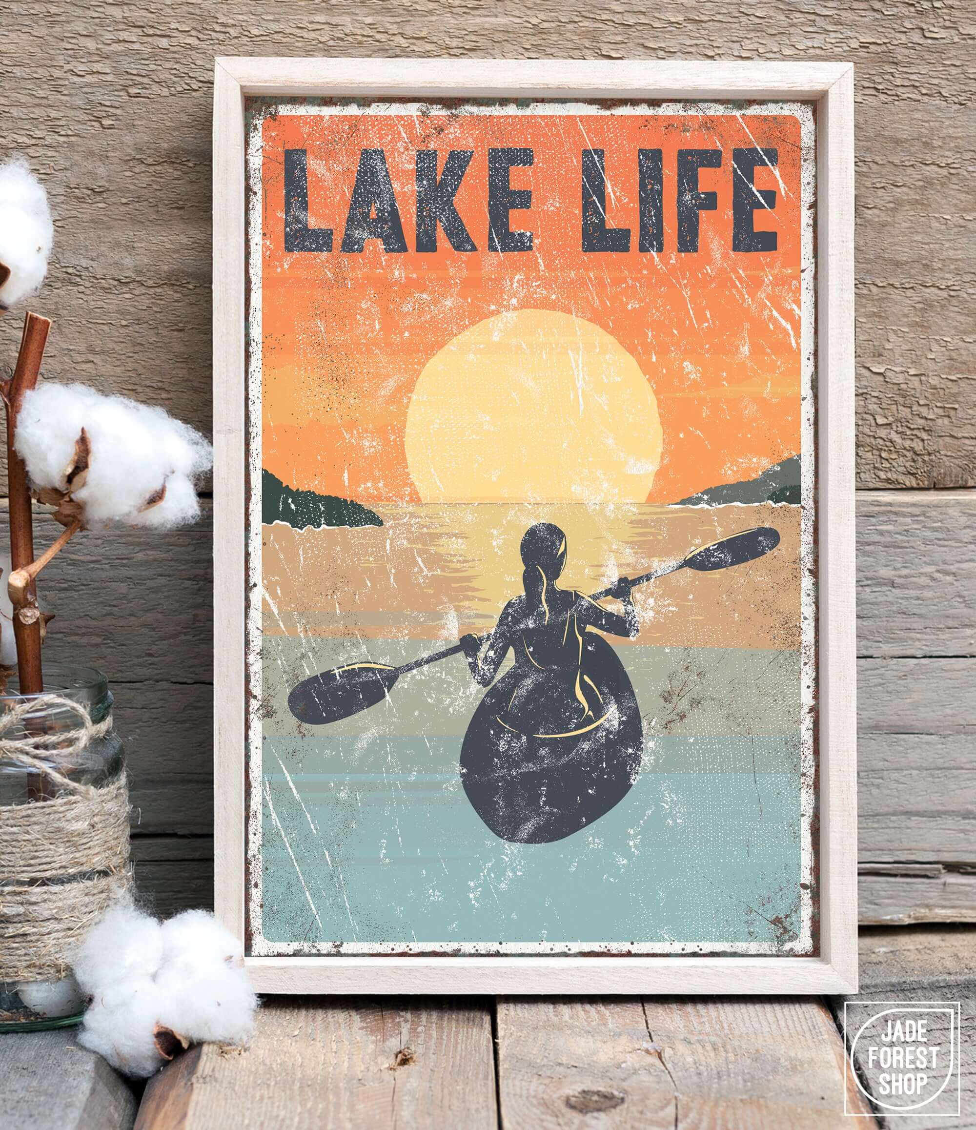 a poster of a person in a kayak on a lake