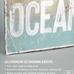a wooden sign that says ocean on it