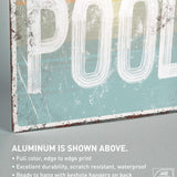 a metal sign that says pool on it