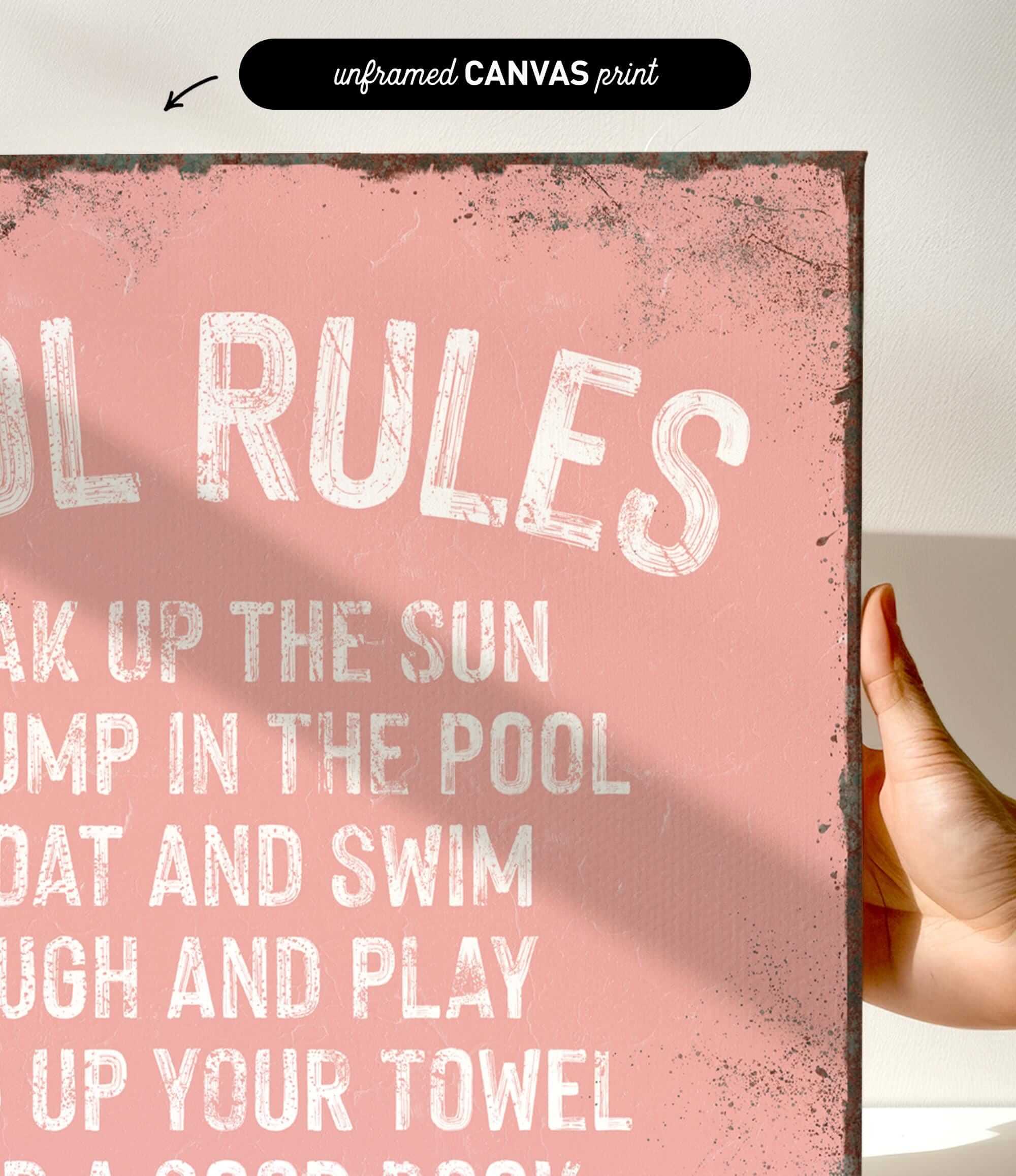 a hand holding a pink sign that says pool rules