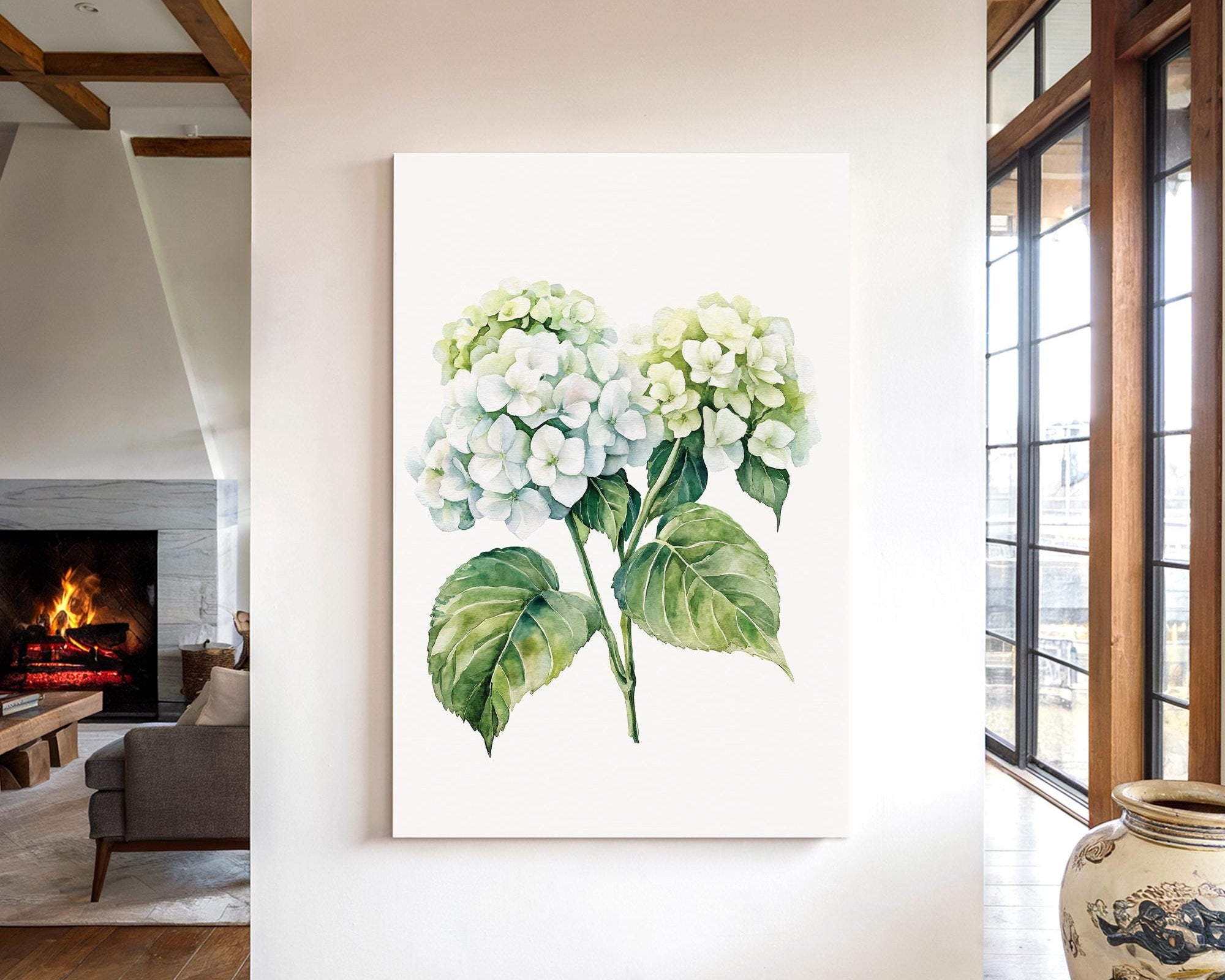 a living room with a large painting of a green and white hydrangea flower hanging on the wall.