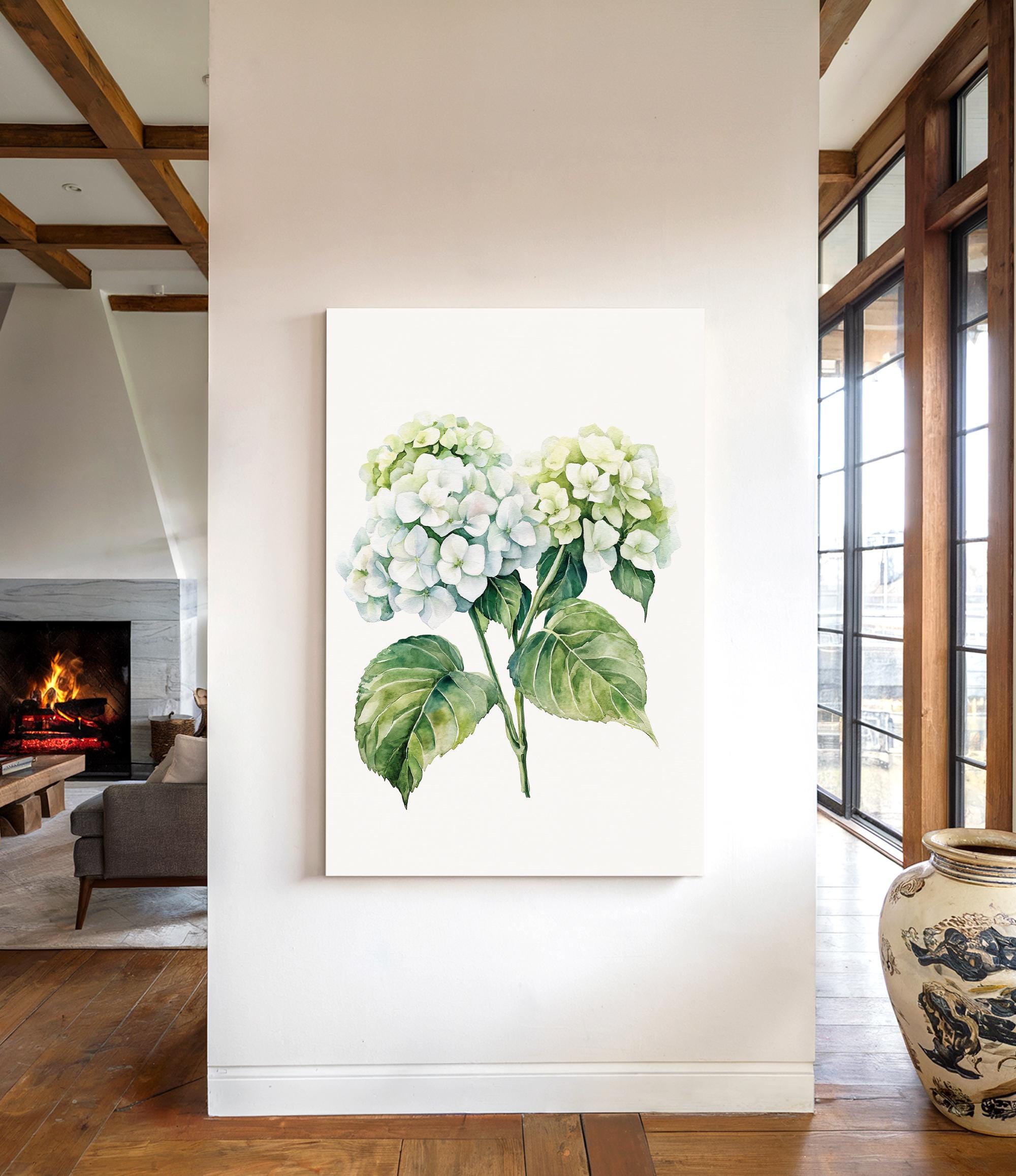 a living room with a large painting of a green and white hydrangea flower hanging on the wall.