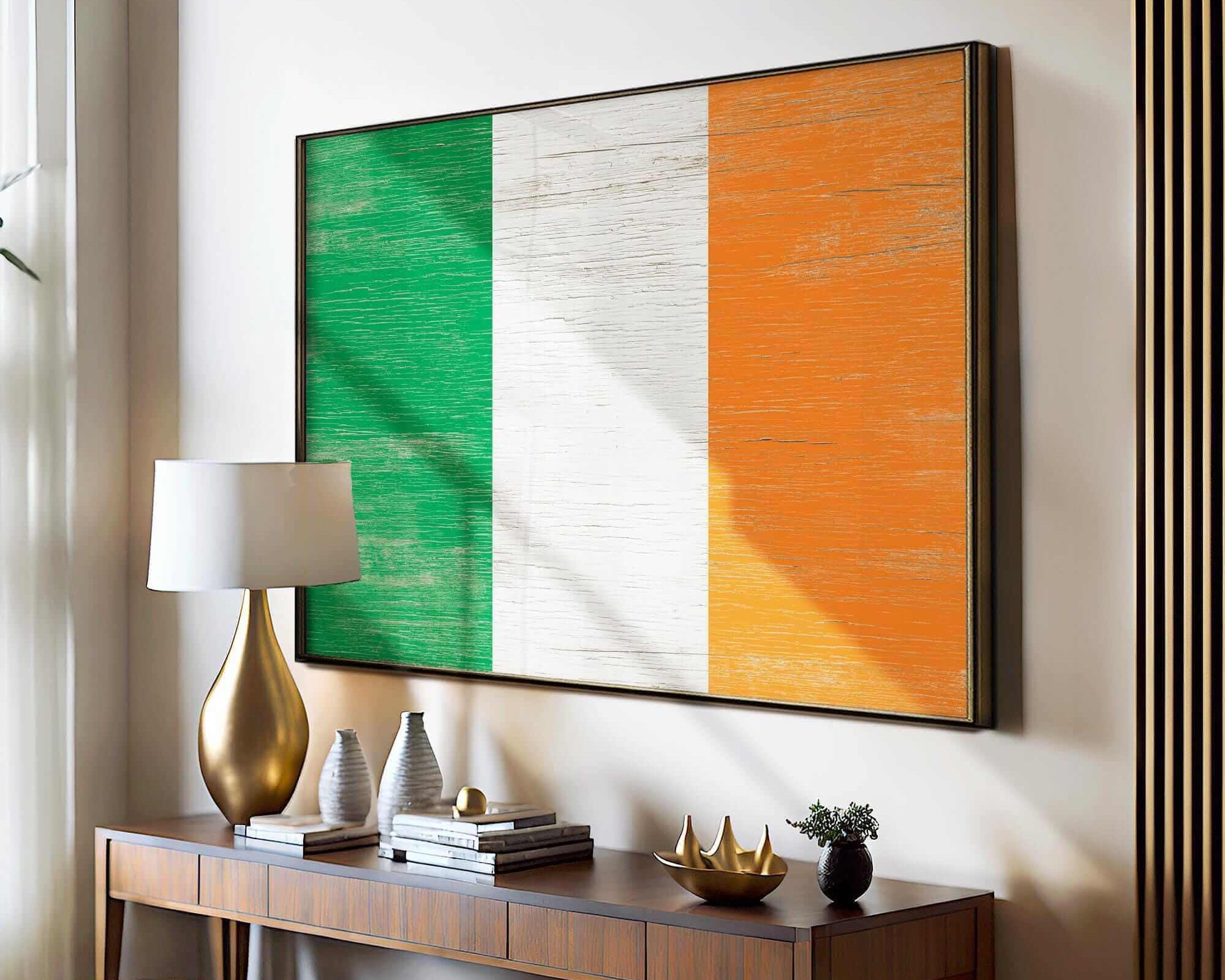a table with a lamp and a painting on the wall
