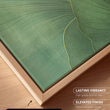 a close-up view of a canvas print with a natural frame, showcasing a vibrant green leaf design.